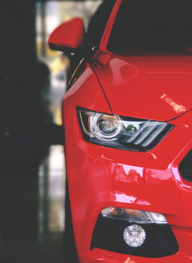 red car parked on pavement